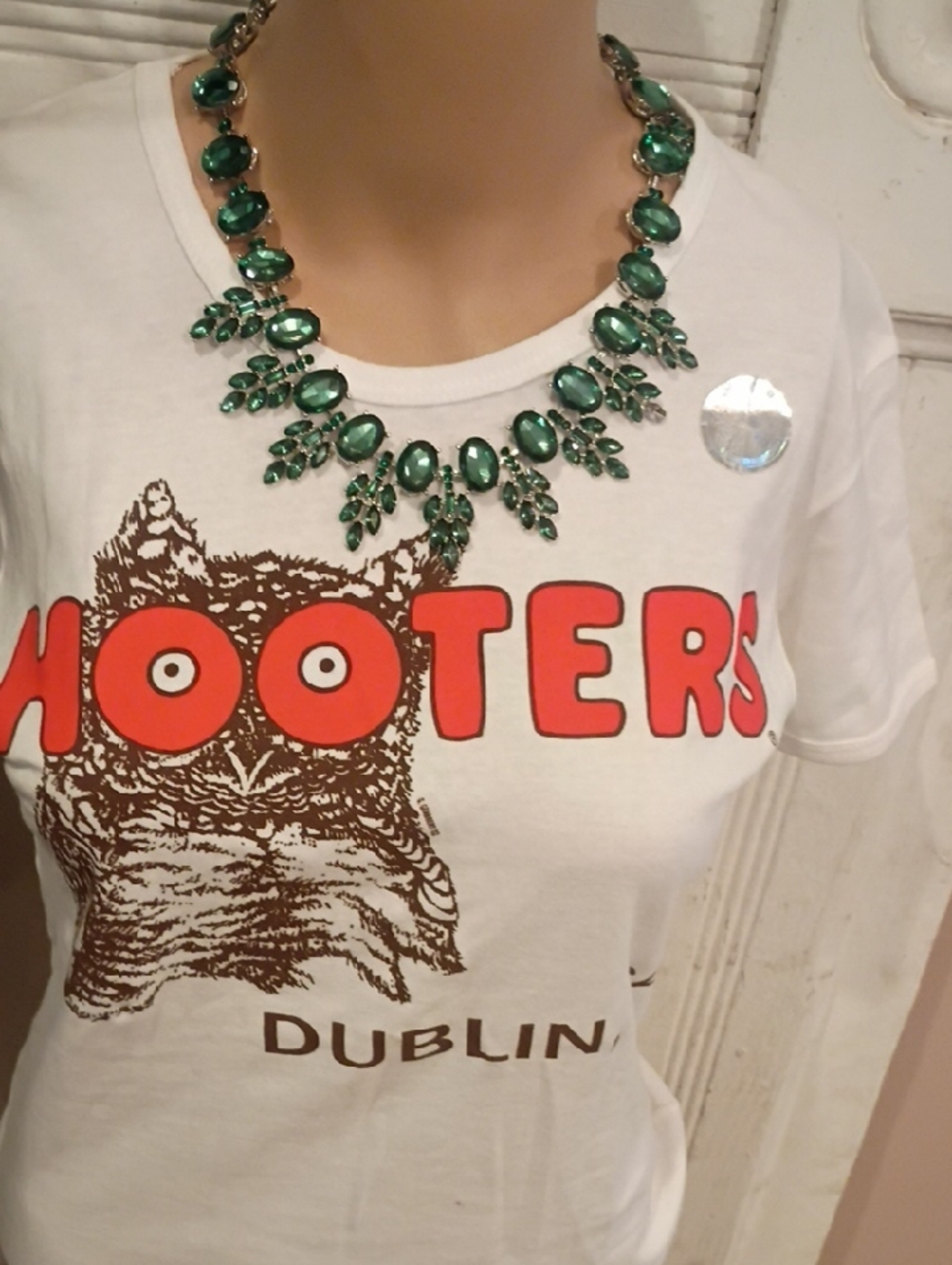 Hooters White Tee with Bold Orange Logo and Emerald Necklace